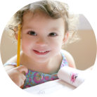 Little girl holding a pen