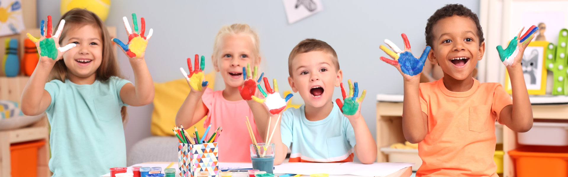 kids showing their hands with paint