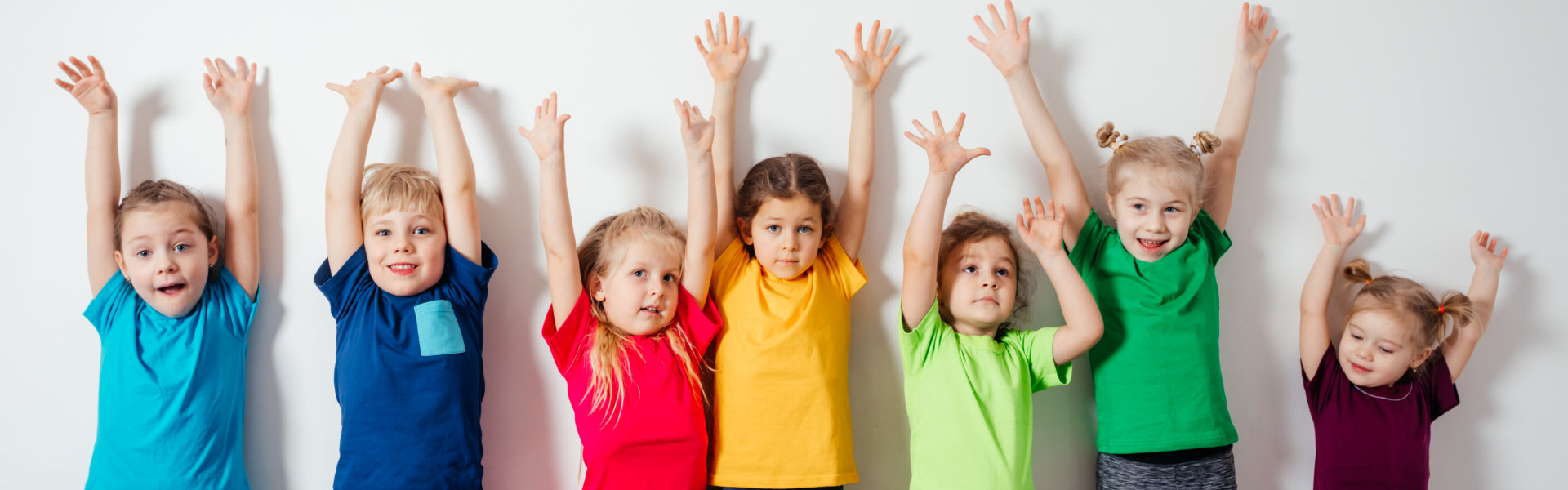 kids raising their hands